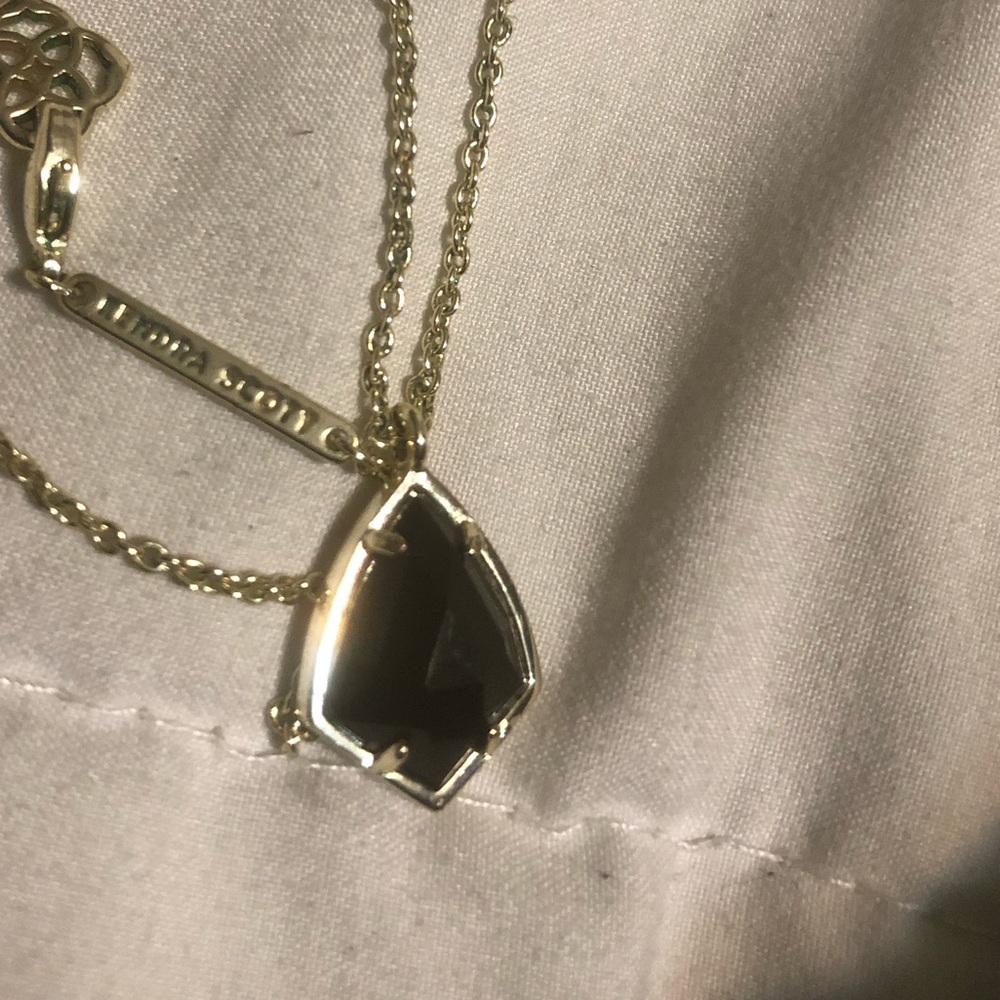 Kendra Scott gold necklace with black pendant